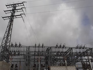 View Of An Electrical Substation With Many Tall Poles And Wiring Lines. Electric Consumption....