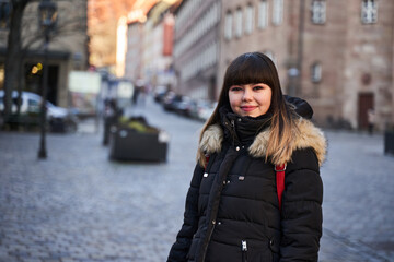 Urban portrait of a woman in winter coat