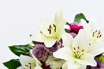 Composition with beautiful blooming lily flowers on white background , macro	
