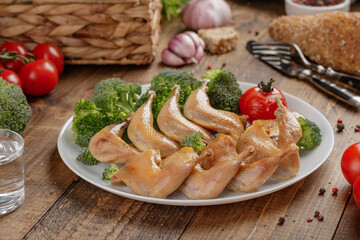 Roasted quail wings with vegetables
