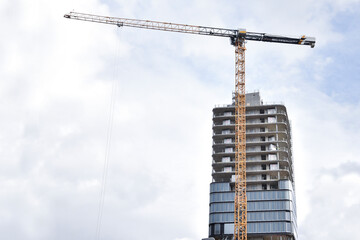 Crane and building under construction , modern 