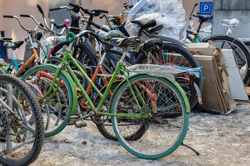 Moscow, Russia - March 02, 2022: spontaneous parking of old bicycles in the yard