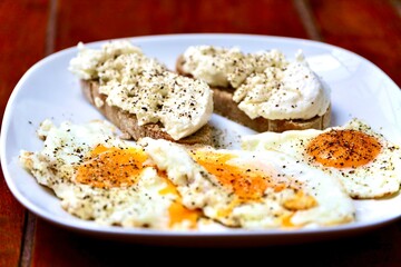 breakfast with egg and bread with some cream cheese