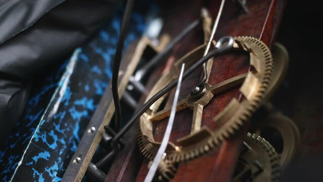 Close up of a brass clockwork from an antique cuckoo clock