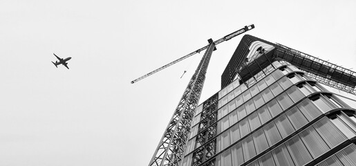 Crane and building under construction , modern 