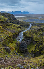 Beautiful autumn view from Múlagljúfur Canyon to Fjallsárlón glacier with Breiðárlón ice lagoon, Iceland and Atlantic Ocean in far. It is south end of Vatnajökull icecap and Öræfajökull volcano.