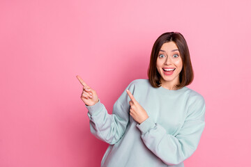 Photo of youth cheerful lady indicate fingers empty space proposition suggest direct isolated over pink color background - obrazy, fototapety, plakaty
