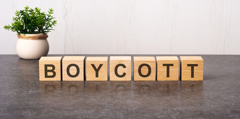 word boycott made with wood building blocks