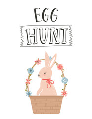 An Easter greeting card with a cute bunny sitting in a wicker basket decorated with simple flowers. The hand lettering phrase - Egg hunt. Color flat cartoon vector illustration on white background.
