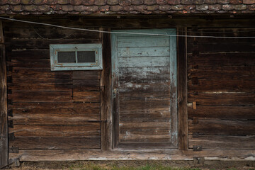 Sunja, Croatia, 05,04,2021: Old wooden rustic doors on rural home wall.
