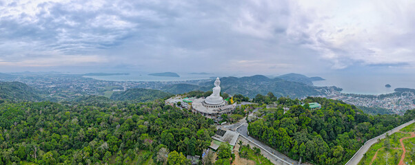 Back and left side of white buddha statute with panorama view place on mountain in southern part of...