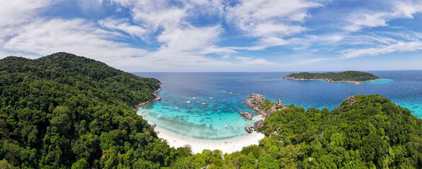 Fototapeta na wymiar Panorama and aerial view of beach of one island in Similan Islands of Thailand during daylight with sunny sky and some cloud blue sky and emerald water.