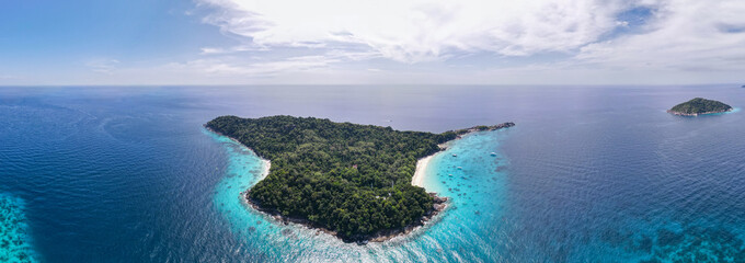 Panorama and aerial view of one island in Similan Islands in Thailand during daylight with sunny...