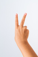 child making number 2 sign on a white background.