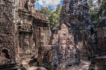 Сourtyard of ancient Cambodian temple among trees in Angkor complex, Siem Reap, Cambodia