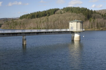 Bridge and intake tower of Lake Breitenbach Talsperre water reservoir (Siegerland), clear winter...