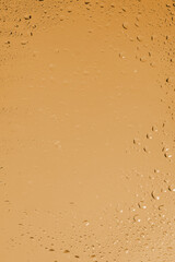 Yellow backgrond with water drops.