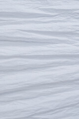 Crumpled white paper background.