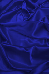 Purple silk or satin luxury fabric texture can use as abstract background.