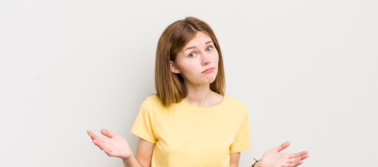 red head pretty woman feeling puzzled and confused, unsure about the correct answer or decision,...