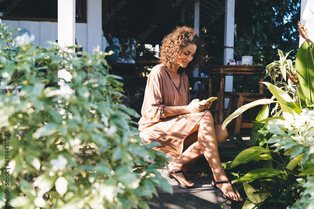 Aufkleber young hipster girl connecting to 4g wireless for reading received email message and writing text ans