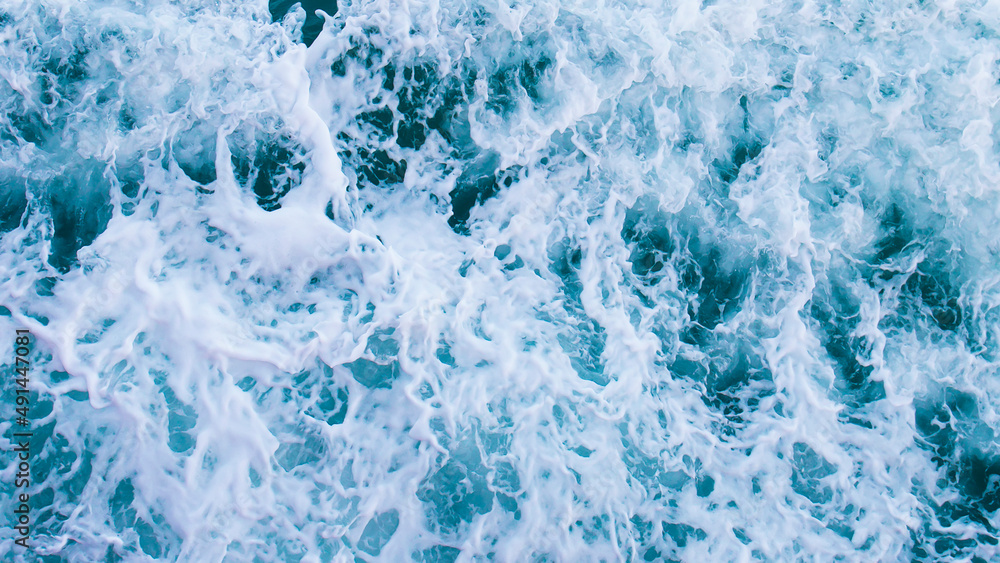 Aufkleber top view with waves and bubbles of ocean blue water surface.