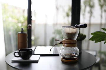 Coffee drip pot and wooden coffee grinder