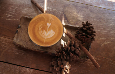 coffee beans and sticks on wooden background