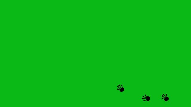 Loop animation of the black silhouette of the legs of a frog, toad or reptile. On a green chroma key background