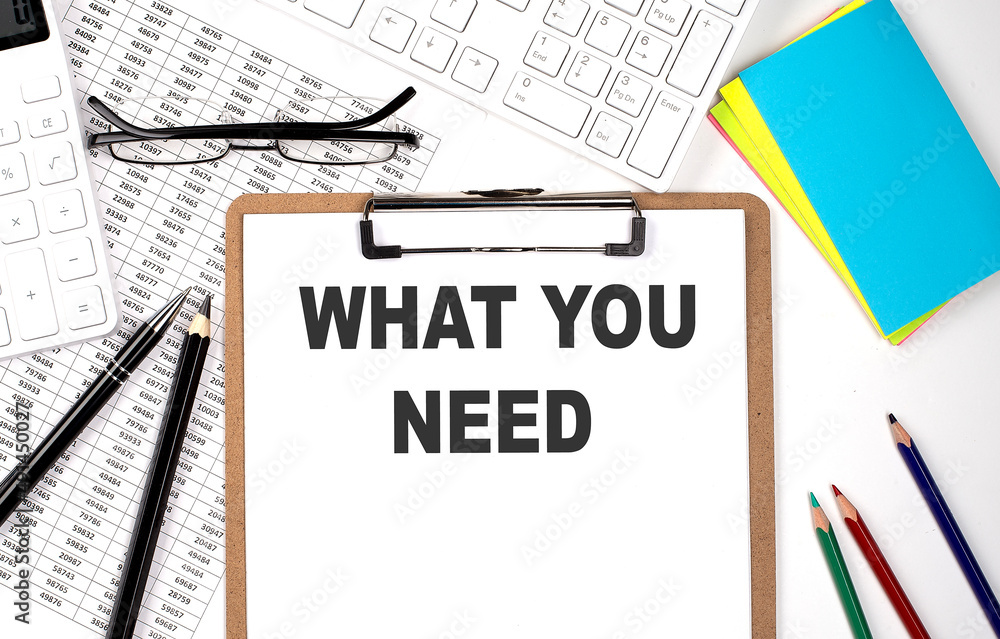 Poster clipboard with text what you need keyboard and chart on white background.