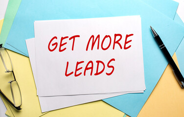 GET MORE LEADS text on paper on colorful paper background