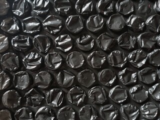 background of black bubble wrap 