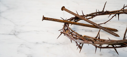 Crucifixion Of Jesus / religion easter background - Crown Of Thorns and rusty old nails on white...