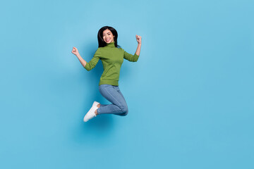 Fototapeta na wymiar Full body photo of hooray young brunette lady jump yell wear jumper jeans sneakers isolated on blue background