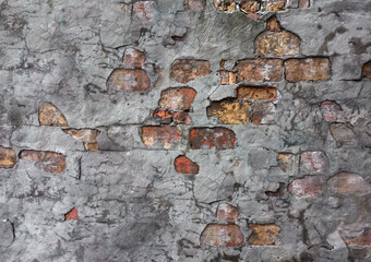 shabby concrete wall with stones background