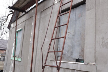 Russia's war with Ukraine. Windows in a house clogged with metal sheets in Kharkov