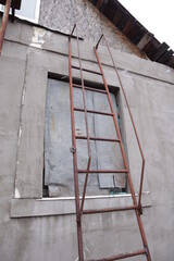 Russia's war with Ukraine. Windows in a house clogged with metal sheets in Kharkov