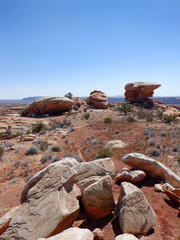 Massive cliff side balancing rock formations and hoodoos in the Bears Ears wilderness area of Southern Utah.  