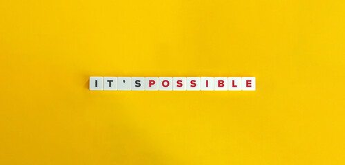 It Is Possible Message on Letter Tiles on Yellow Background. Minimal Aesthetics.