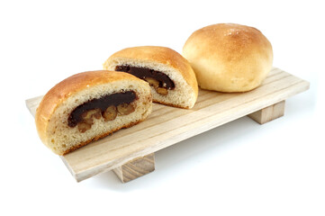 Freshly baked buns lotus red bean cut in half put side by side