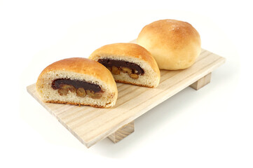 Freshly baked buns lotus red bean cut in half put side by side