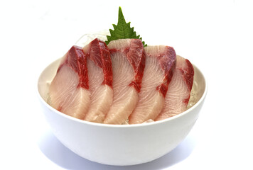 Sashimi sliced hamachi, placed on ice in a bowl.
