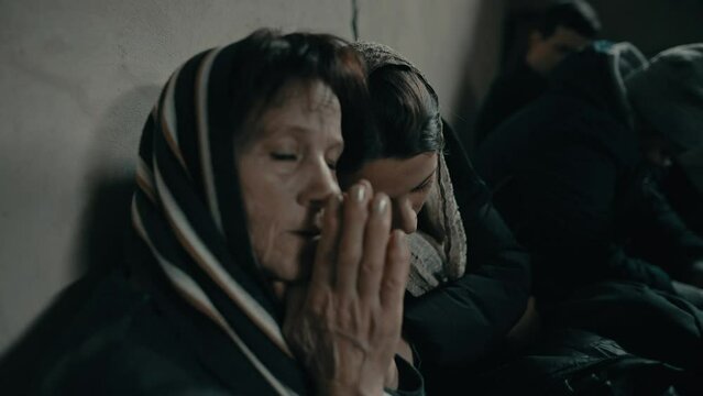 Woman praying during an airstrike