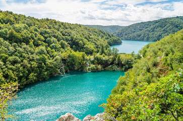 Famous Plitvice Lakes Arranged in Cascades at the National Park in Croatia. Panoramic View of the Turquoise Waters, Waterfalls and Green Trees.