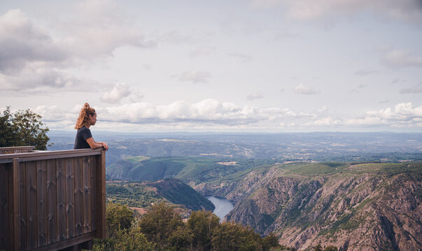 Woman hiker standing and looking at Sil Canyon
