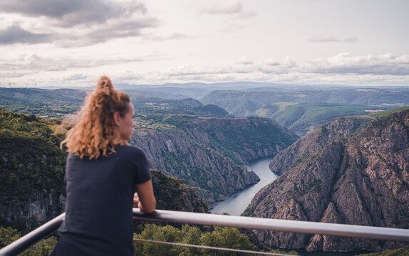 Woman hiker standing and looking at Sil Canyon
