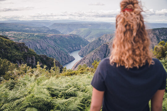 Woman hiker standing and looking at Sil Canyon
