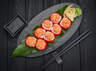 Sushi rolls with salmon tempura and tobiko caviar