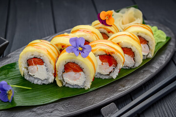 Sushi rolls with salmon, shrimp and mango.
