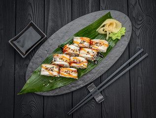 Sushi roll dragon with smoked eel and shrimp.